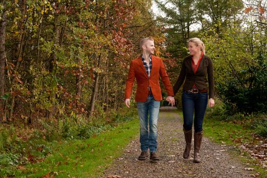 Happy young couple is having a nice time in october