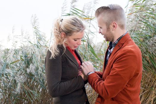 Happy young couple is having a nice time in october