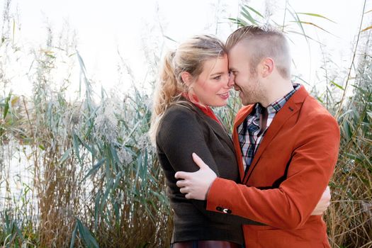 Happy young couple is having a nice time in october