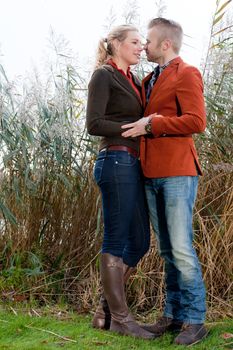 Happy young couple is having a nice time in october