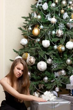 girl near Christmas tree home
