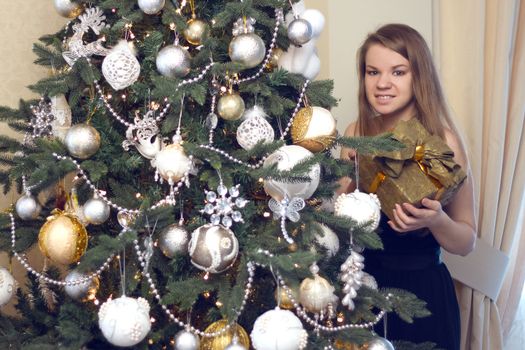 girl near Christmas tree home