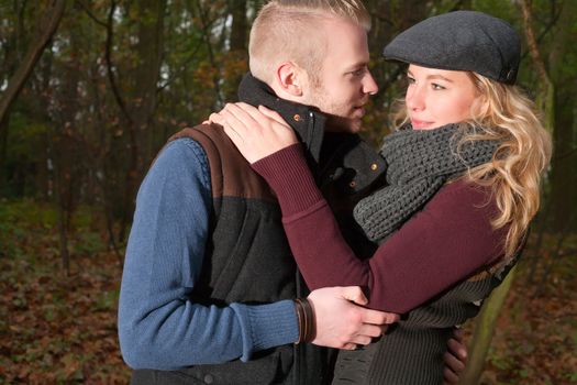 Happy young couple is having a nice time in october