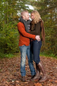 Happy young couple is having a nice time in october