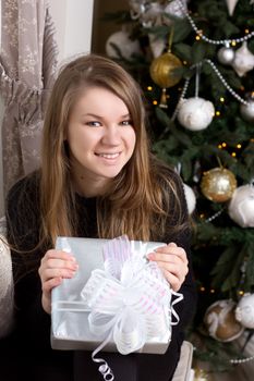 girl near Christmas tree home