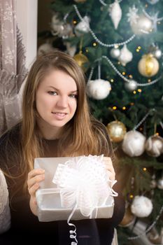 girl near Christmas tree home