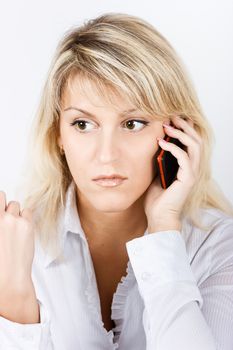 Portrait of attractive blond girl with a mobile phone