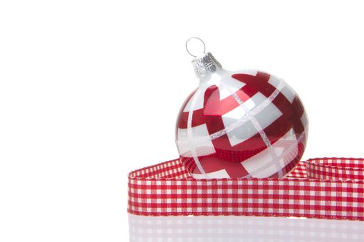 red and white christmas bauble isolated with white background 