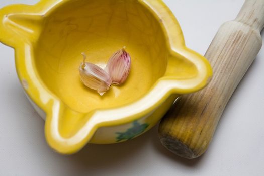   Ceramic mortar and garlic, used in the Spanish traditional kitchen, Spain