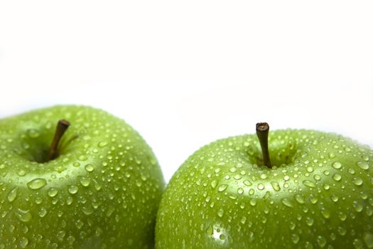 green apple fruits with leaf isolated on white background