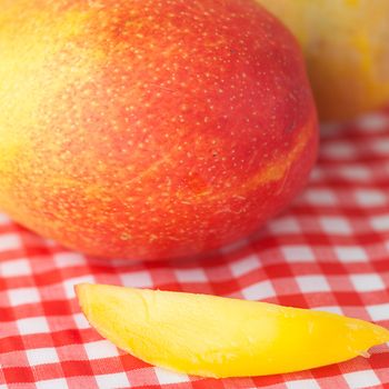 mango fruit on checkered fabric