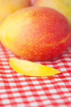 mango fruit on checkered fabric