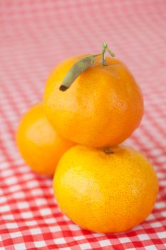 tangerine on checkered fabric