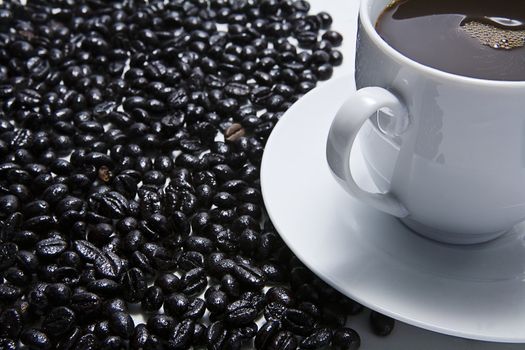 Traditional cup of coffee and coffee beans roasted