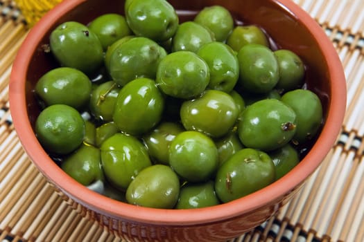 Bowl with green olives dressed, a typical product of Andalusia, Spain
