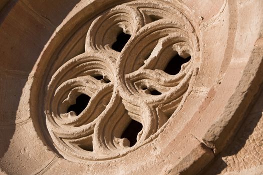 Occulus gothic. Details of the front of the side entry of the Church of Santa Maria, Linares, Jaen province, Andalusia, Spain