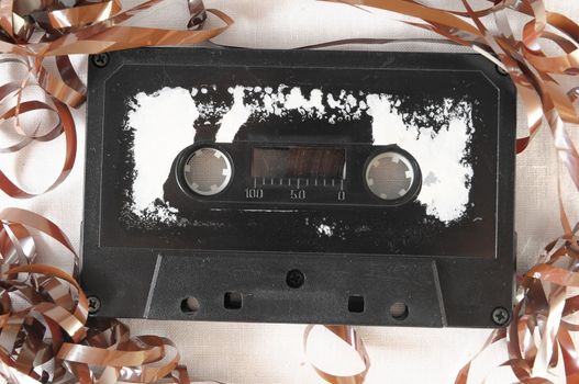 Ancient Vintage Used Musicassette over a White Background