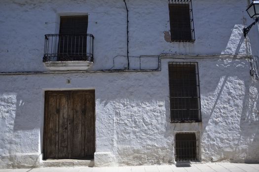 Typical facade of whitewashed house in Sabiote, Jaen province, Andalusia, Spain