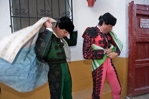 Bullfighters getting dressed for the paseillo or initial parade. Taken at Linares bullring before a bullfight, Linares, Spain, 29 august 2010