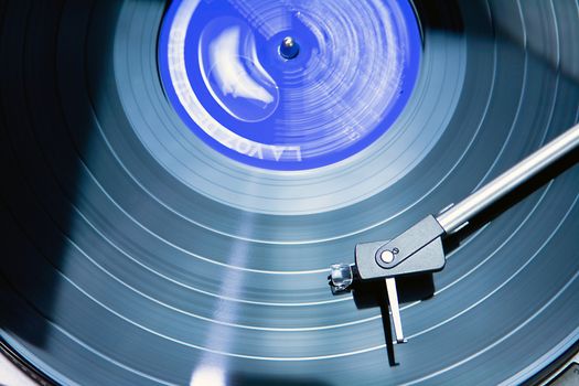 Vintage record player with spinning vinyl. 