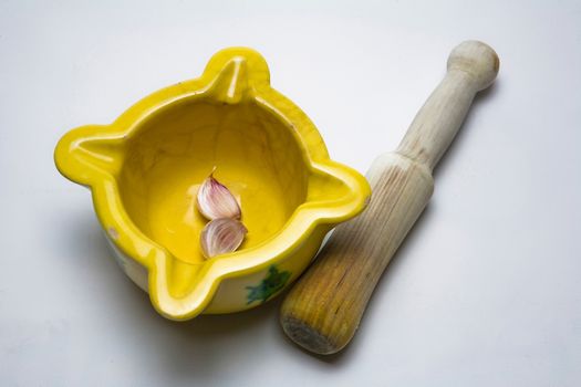   Ceramic mortar and garlic, used in the Spanish traditional kitchen, Spain