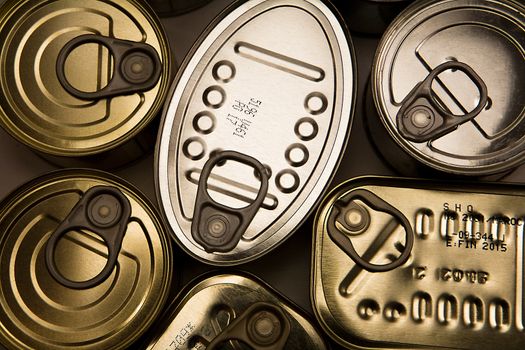 Tins of different sizes and opening