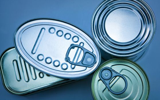Tins of different sizes and opening