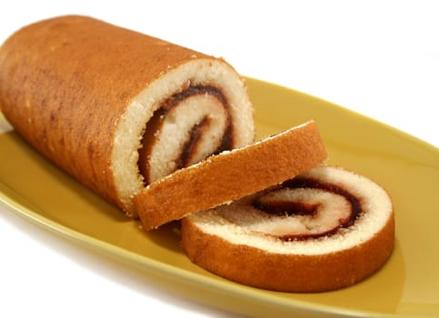 Sliced strawberry jam roll ready to serve.
