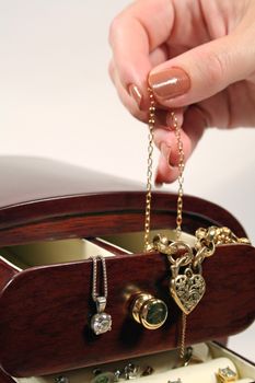 Female deciding what jewellery to wear.