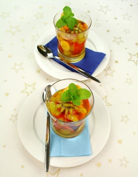 Fresh sliced tropical fruit set in pineapple jelly.
