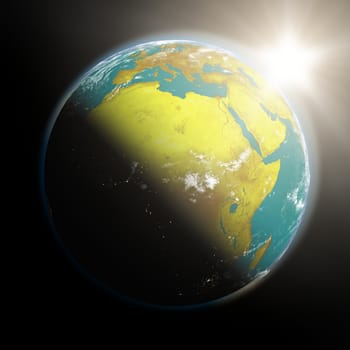 Space view of the sun rising over Africa on planet Earth. Elements of this image furnished by NASA.