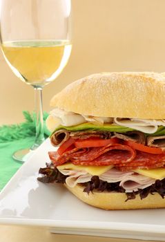 Mega meat roll consisting of ham, salami, roast beef and turkey with cheddar cheese and salad.