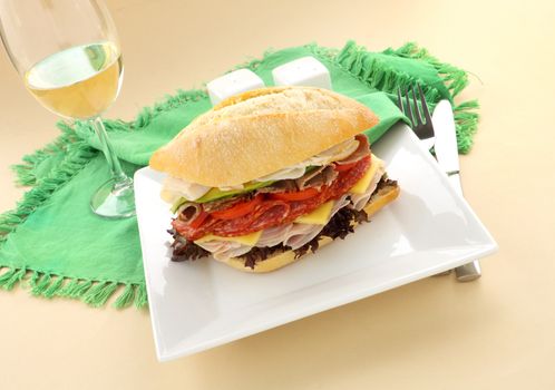 Mega meat roll consisting of ham, salami, roast beef and turkey with cheddar cheese and salad.