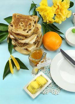 Homemade orange marmalade jam with toast and fresh orange.