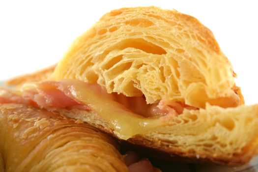 Hot melted cheese and ham croissant ready to serve