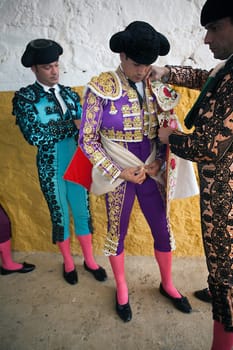 Bullfighters getting dressed for the paseillo or initial parade. Taken at Linares bullring before a bullfight, Linares, Spain, 11 september 2009