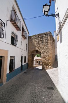 Mudejar door to the village at the end of the street,  Sabiote, Jaen province, Andalusia, Spain