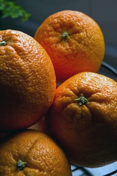 Some oranges in a bowl