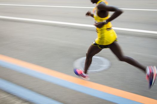 Marathon runners on the Road. Motion blurred