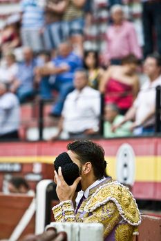 Bullfighter praying with his montera, Jaen, Spain