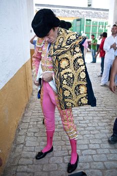 The spanish bullfigher Jose Tomas getting dressed for the paseillo or initial parade. Taken at Linares bullring before a bullfight, Linares, Spain, 29 august 2011