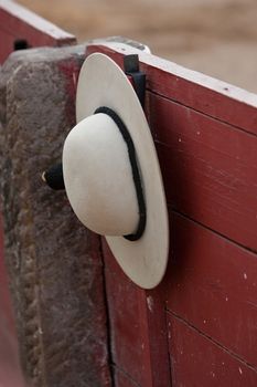 A castoreno (the picador's rounded hat) hanging from the barrier during a bullfight. Linares, province of Jaen, Spain, 30th august 2011