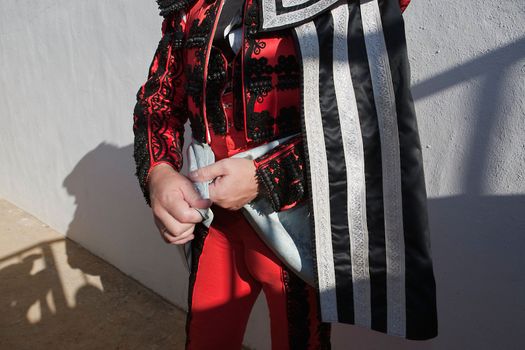 Bullfighter getting dressed for the paseillo or initial parade. Taken at Baeza bullring before a bullfight, Baeza, Spain, 14 august 2010