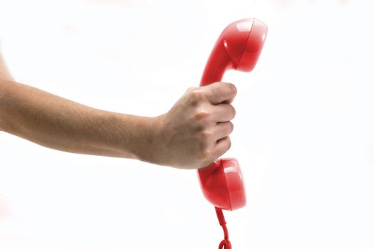 hand holding red telephone a over white background