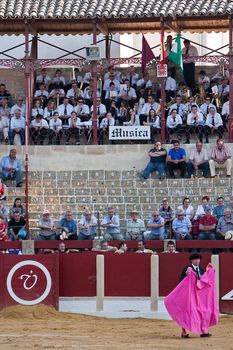 Spectators and music band in a bullfight in Ubeda, province of Jaen, Spain