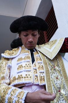 The spanish bullfighter Curro Diaz  getting dressed for the paseillo or initial parade. Taken at Linares bullring before a bullfight, Jaen, Spain, 16 october 2011