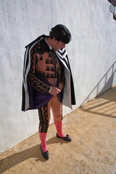 Bullfighters getting dressed for the paseillo or initial parade. Taken at Baeza bullring before a bullfight, Baeza, Spain, 18 august 2010