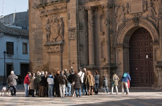 Tourists in Salvador chapel, Ubeda, Jaen province, Spain