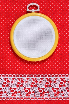Hoop with a white canvas on a fabric background