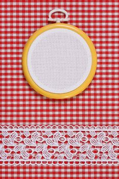 Hoop with a white canvas on a fabric background